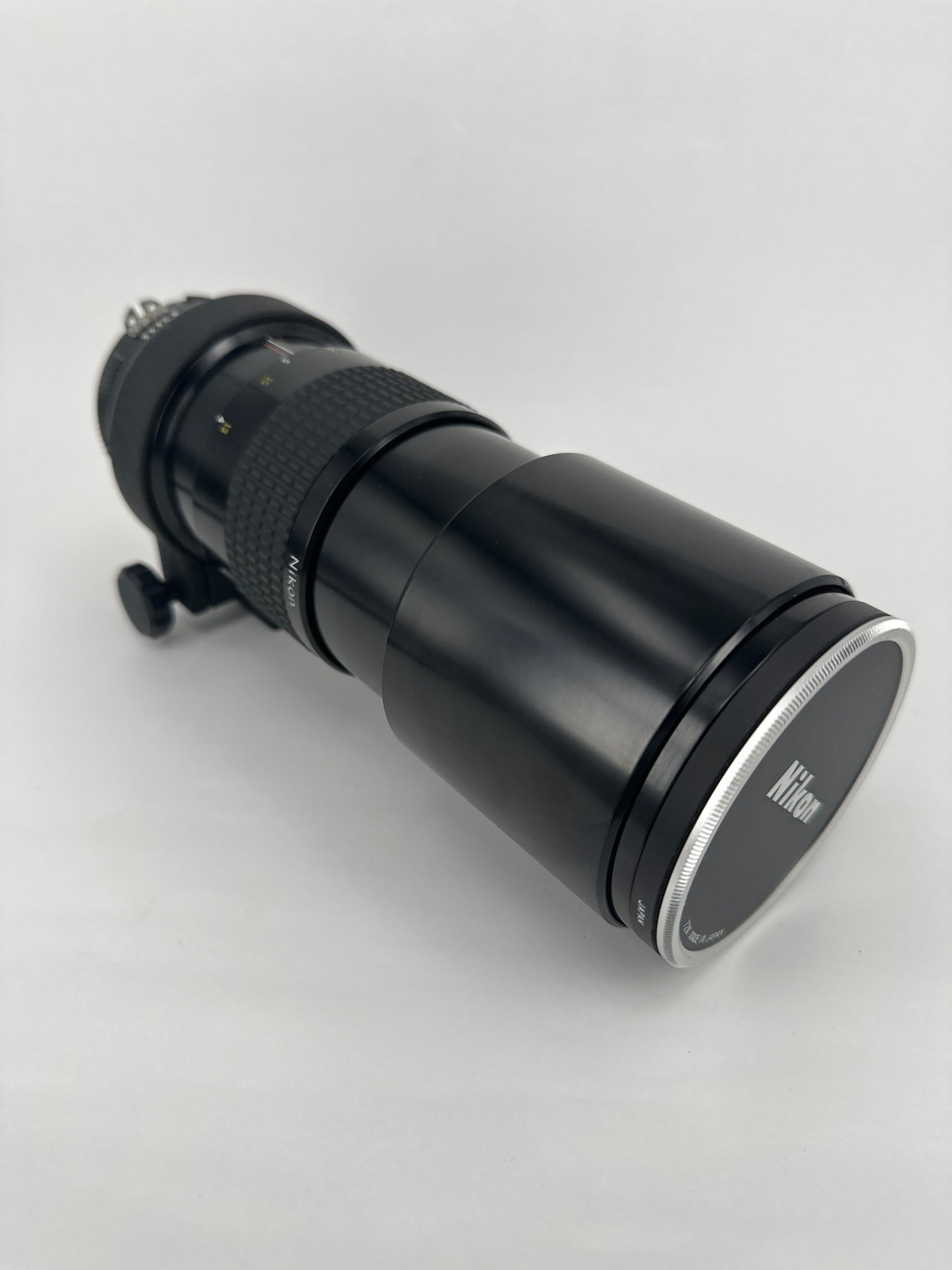 Nikkor 300mm f4.5 Pre-AI with AI adaptation lens with Nikon Lens Cap