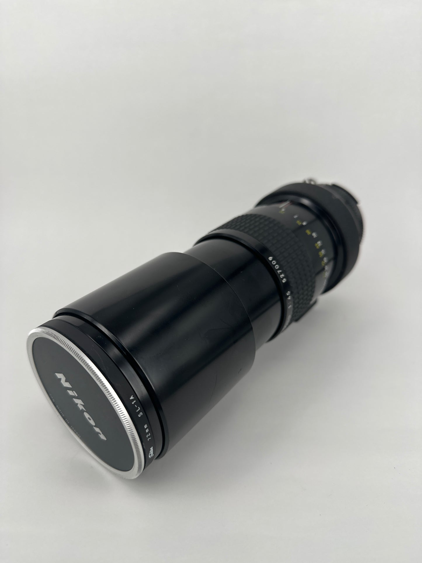 Nikkor 300mm f4.5 Pre-AI with AI adaptation lens with Nikon Lens Cap