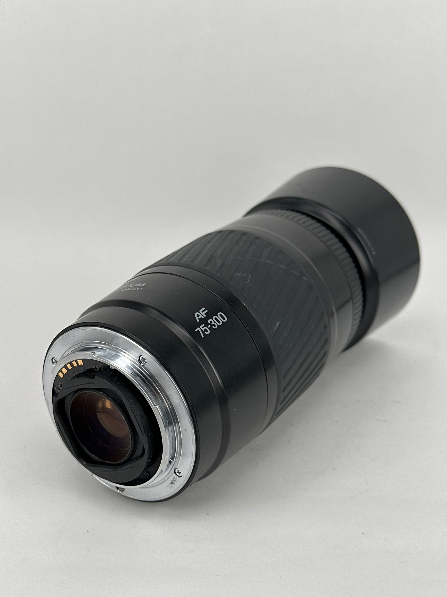 Minolta AF 75-300mm f4.5-5.6 macro lens with cap and hood