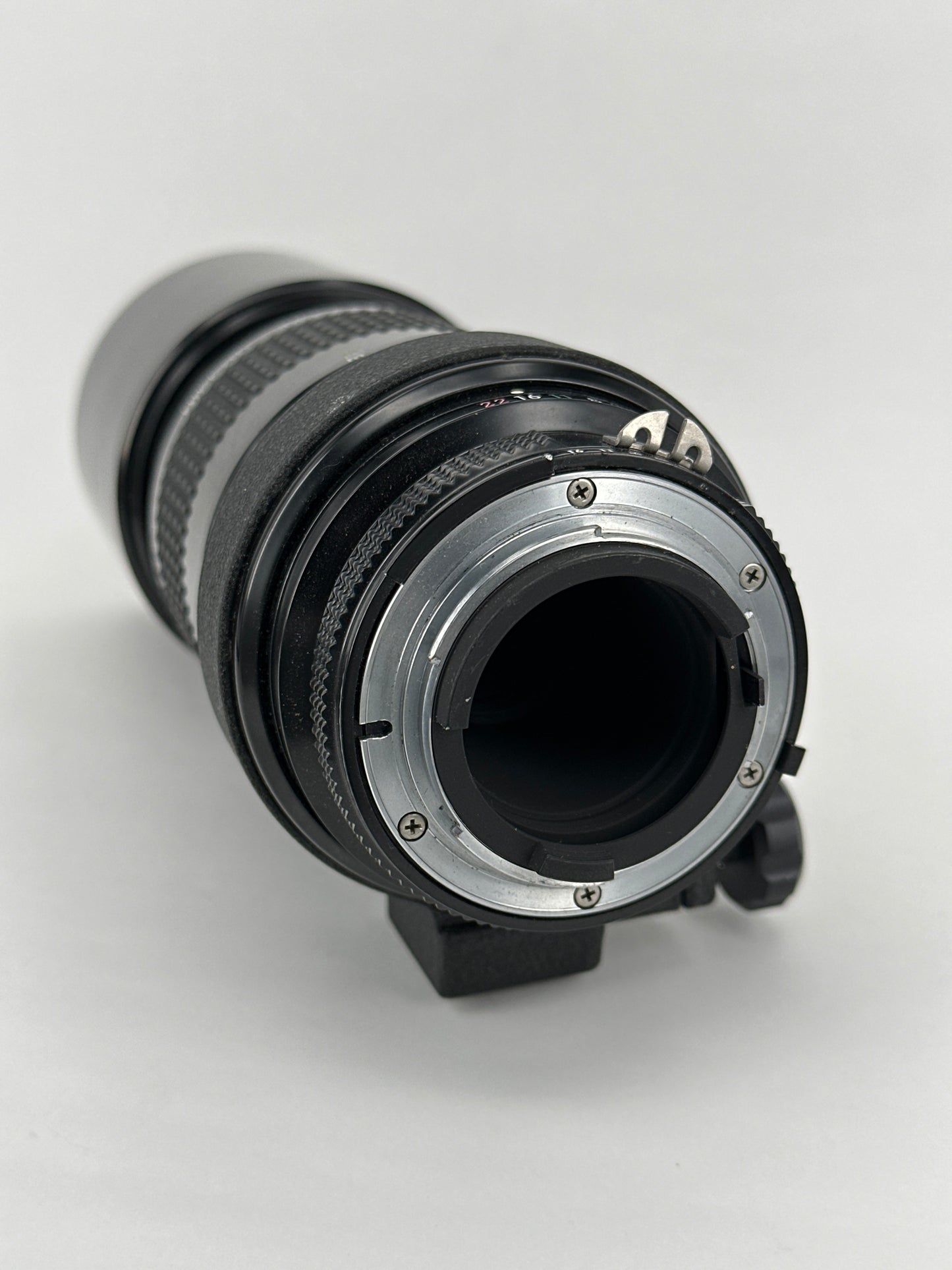 Nikkor 300mm f4.5 Pre-AI with AI adaptation lens with Nikon Lens Cap