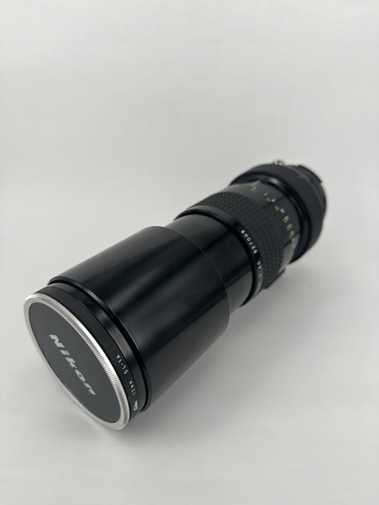 Nikkor 300mm f4.5 Pre-AI with AI adaptation lens with Nikon Lens Cap